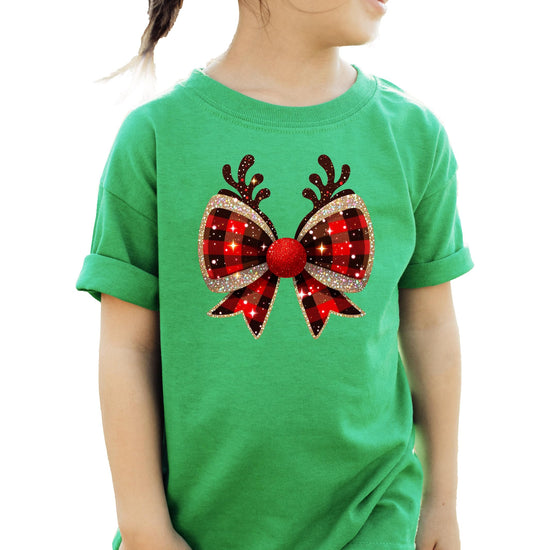 Flat lay of vintage-style Christmas reindeer antlers bow graphic tee in holiday setting