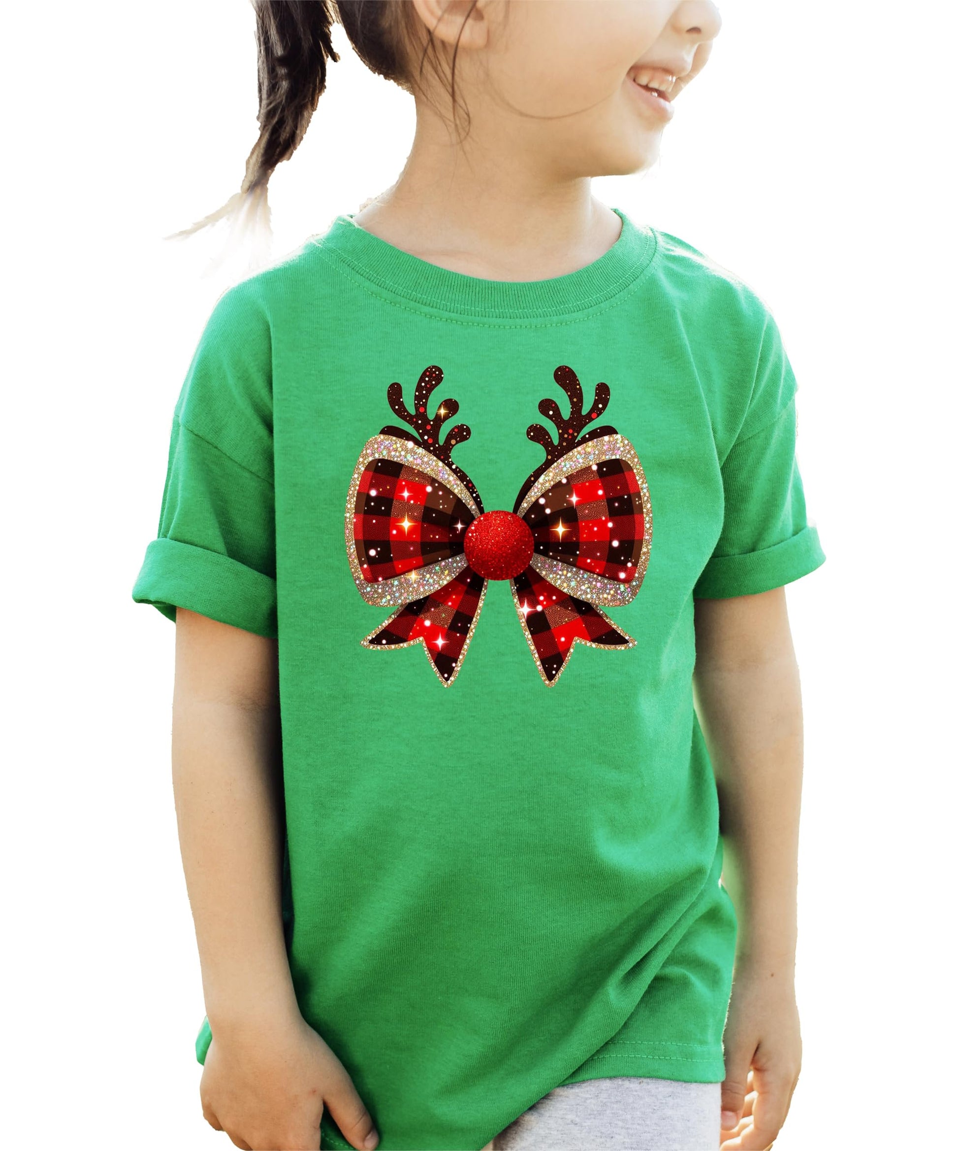 Flat lay of vintage-style Christmas reindeer antlers bow graphic tee in holiday setting