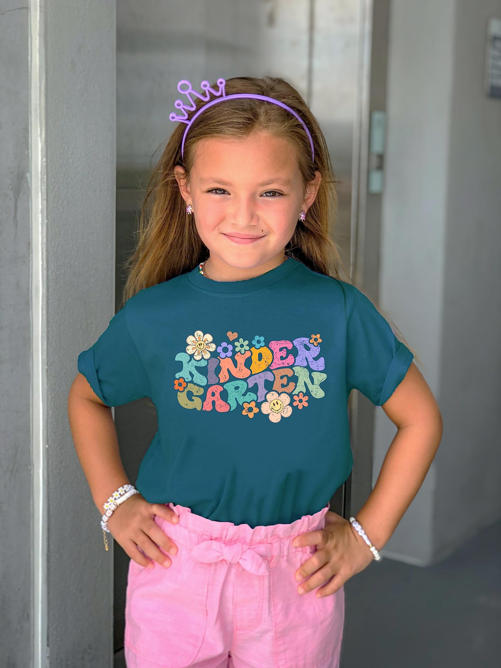 Natural kids graphic t-shirt with colorful groovy daisy kindergarten back to school print, lifestyle shot