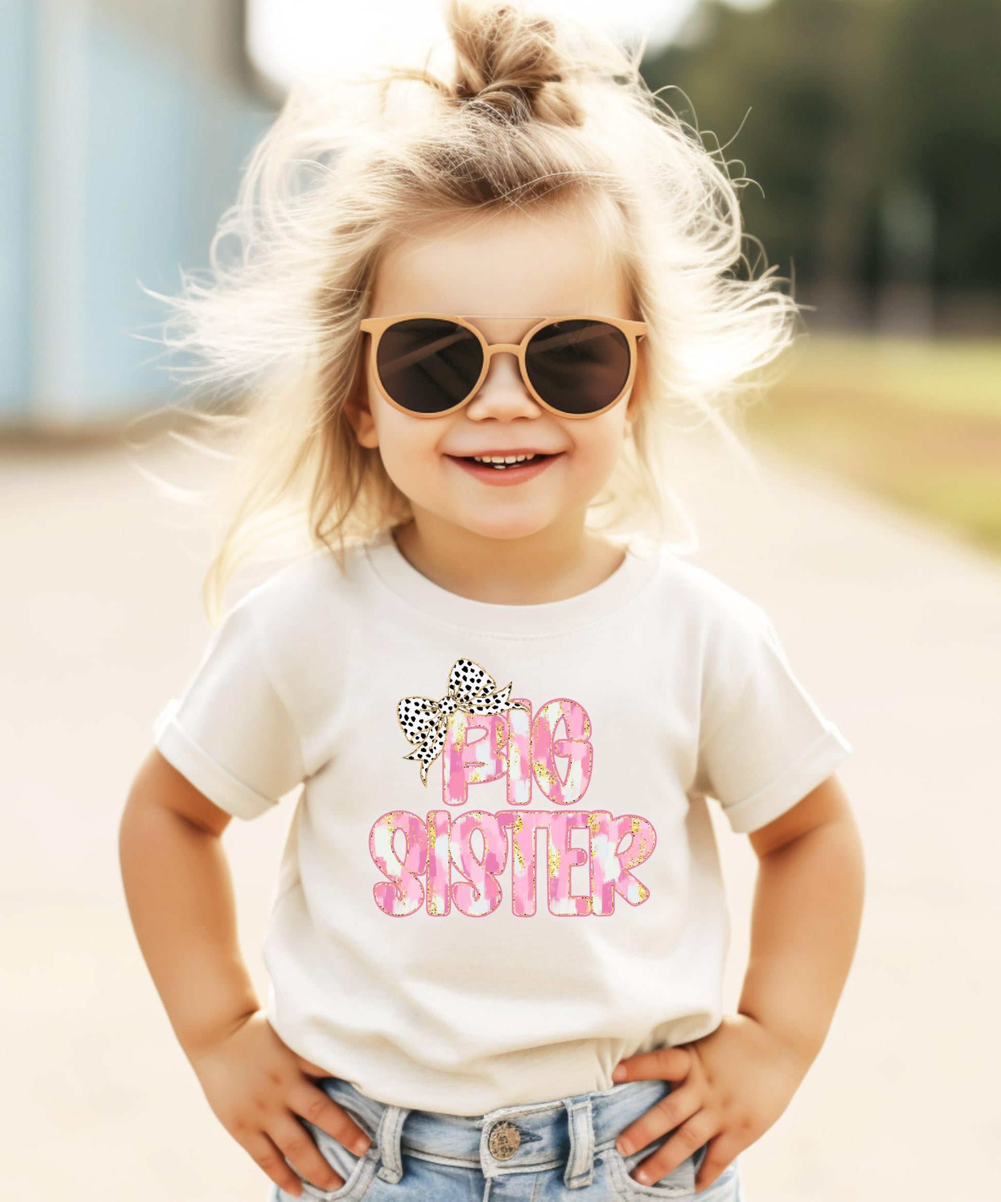Flat lay of black Big Sister bow shirt for infant toddler and youth girls