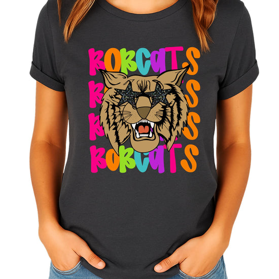 Close-up of Bobcats graphic tee print showing colorful wavy lettering and sparkly sunglasses detail