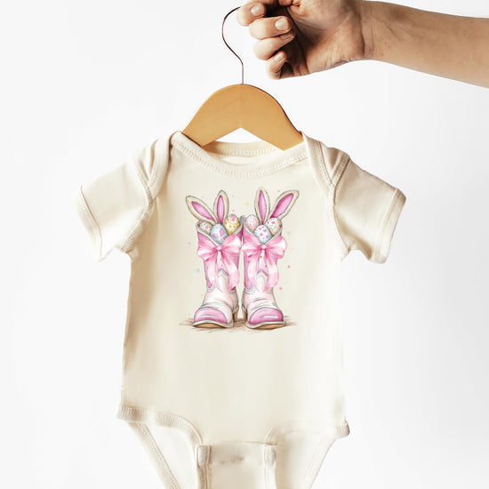 Side detail view of Easter bunny boots baby girl one-piece graphic tee bodysuit