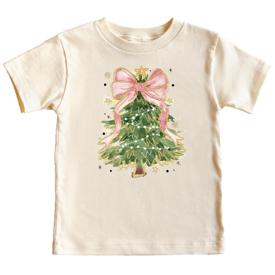 Close-up of Christmas tree with pink bow topper print on a peach graphic tee