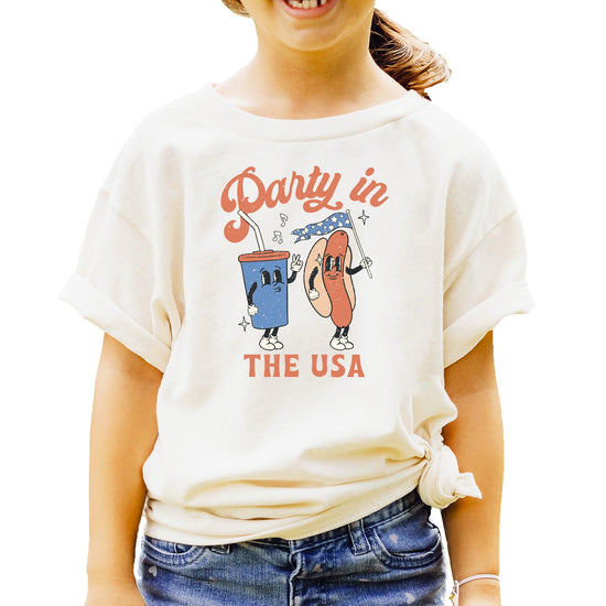 Pink Party in the USA shirt with hotdog and soda graphic design laid flat