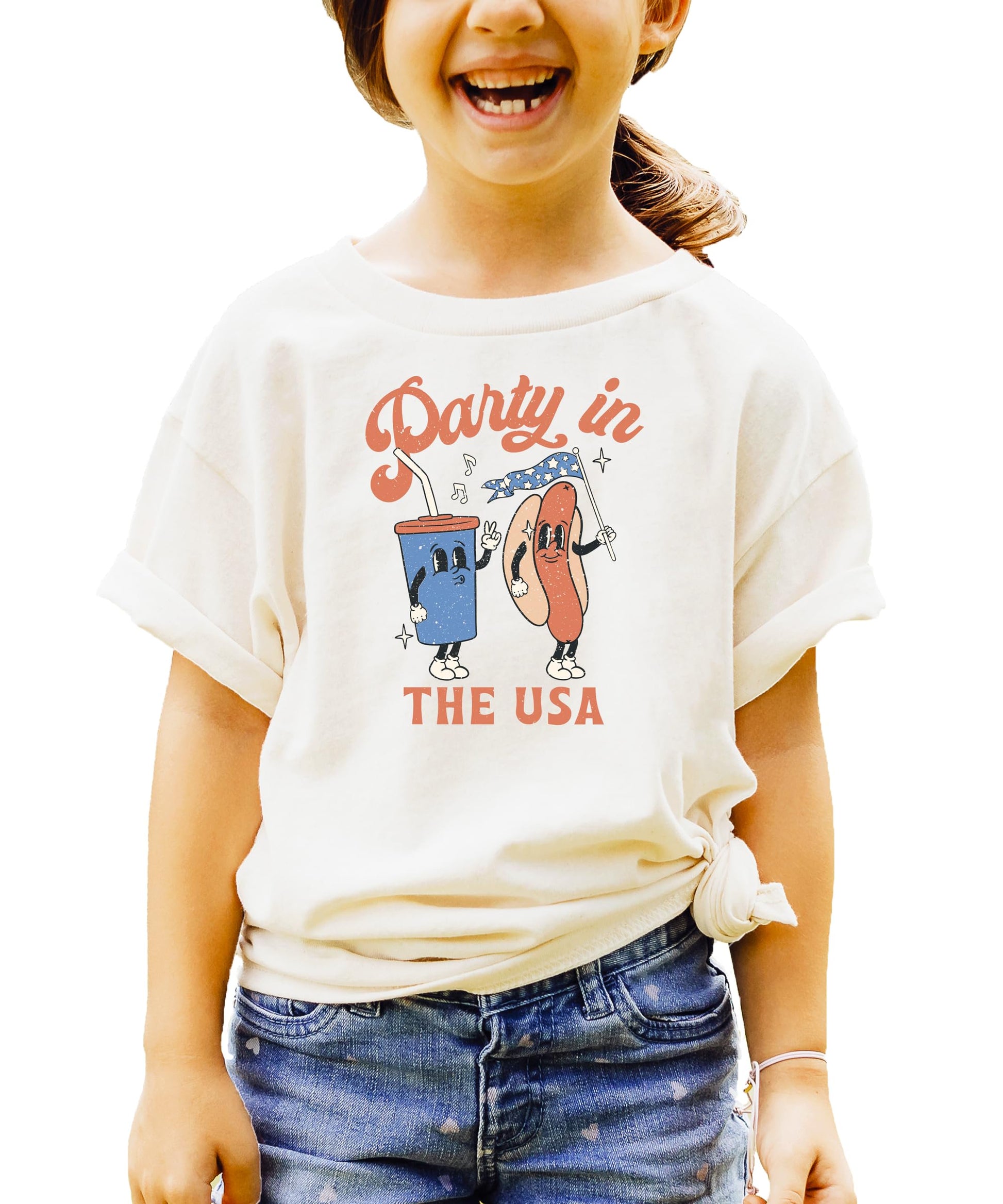 Pink Party in the USA shirt with hotdog and soda graphic design laid flat