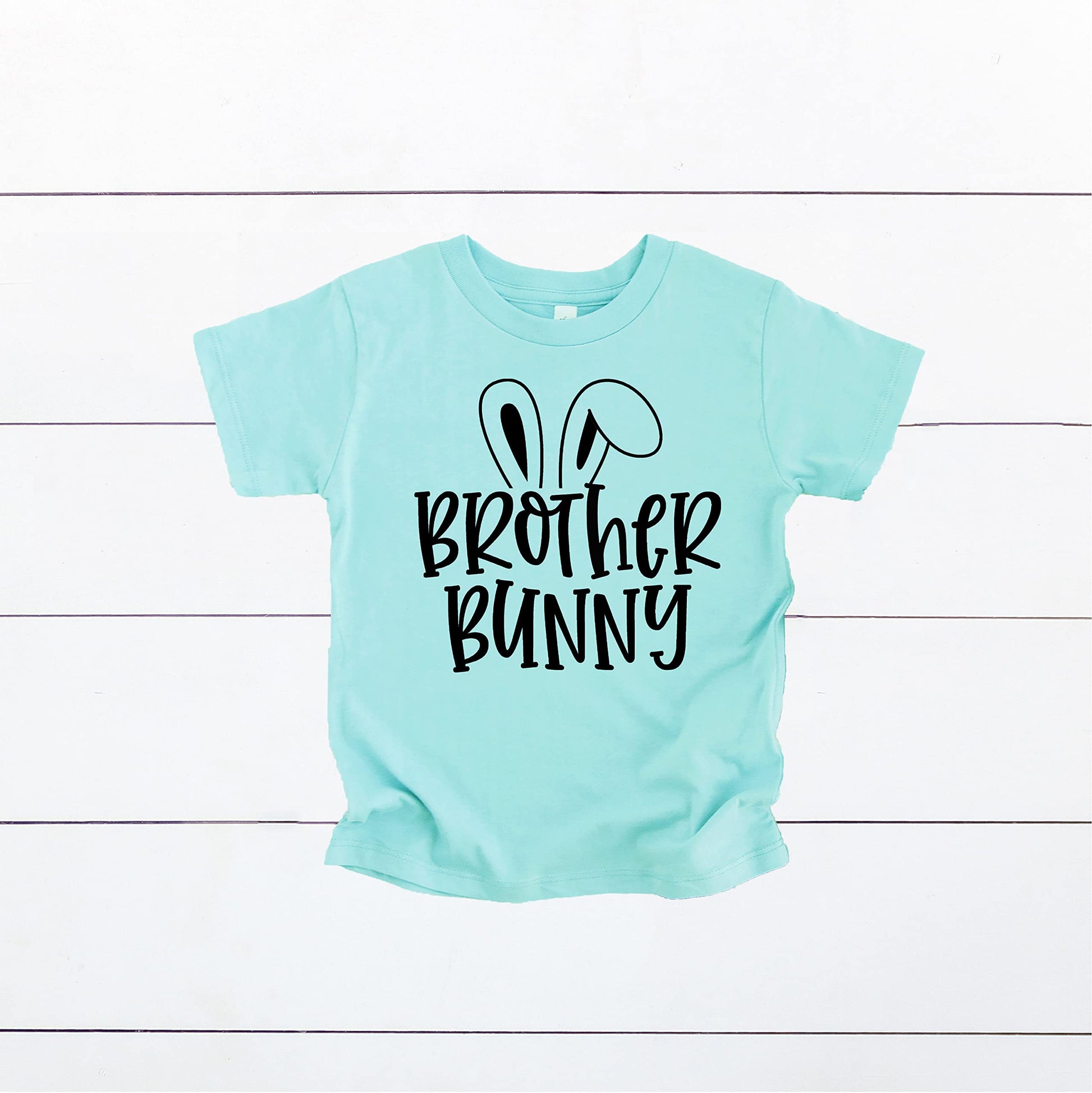 Flat lay of Baby Bunny Chill Easter infant bodysuit showing full graphic design