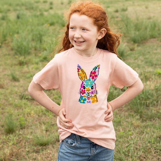 Girls wearing peach floral bunny Easter shirt, fun spring holiday outfit