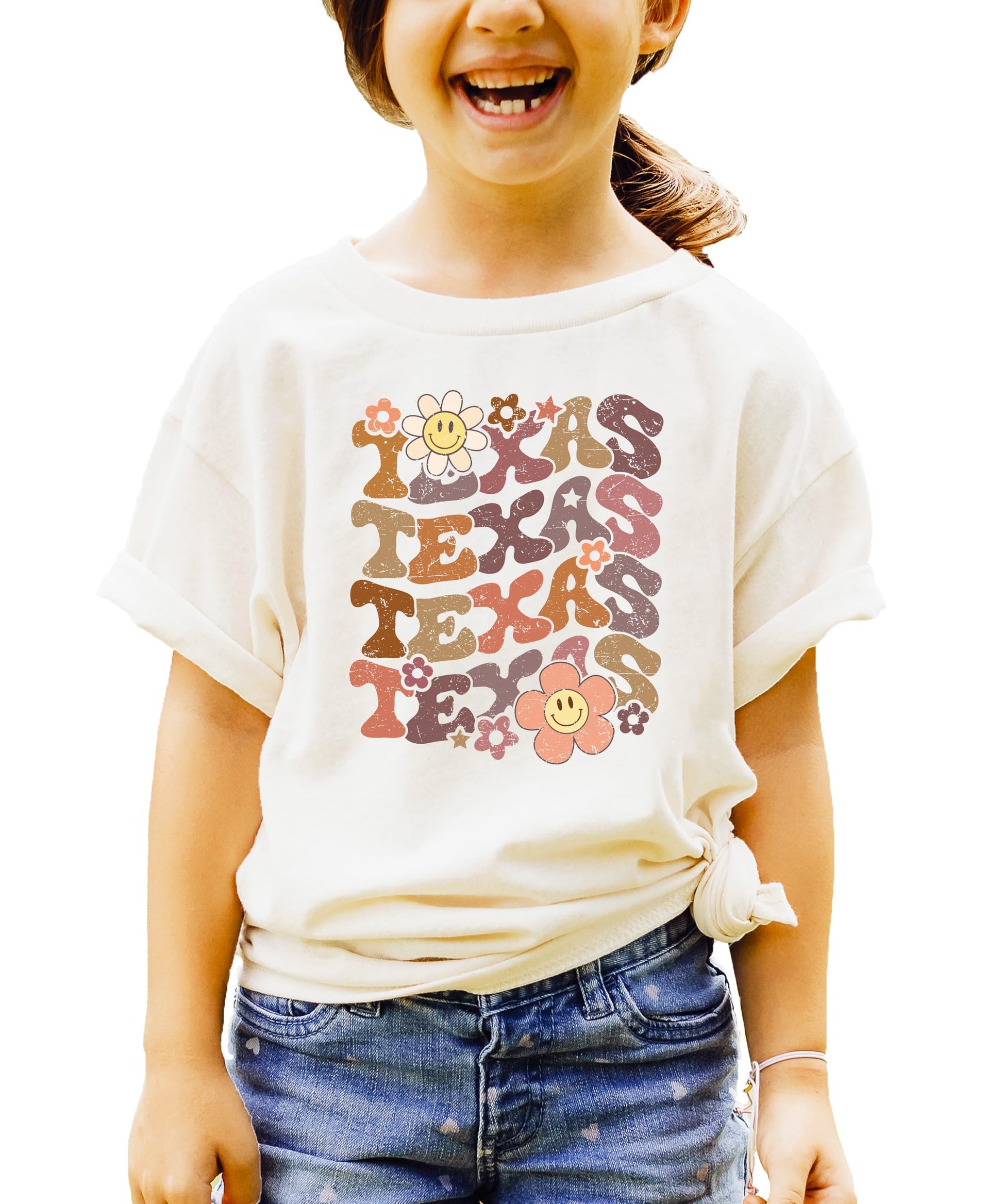 Close-up view of multicolor TEXAS text with vintage smiley face flowers on comfortable graphic tee
