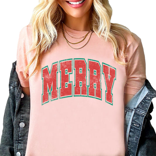 Close-up of Merry varsity letters design printed on a natural unisex Christmas tee