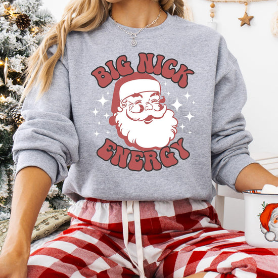 Detail shot of soft fleece fabric and holiday Santa print on Big Nick Energy sweatshirt