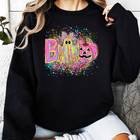 Neon BOO Halloween sweatshirt flat lay showing full ghost and pumpkin graphic print
