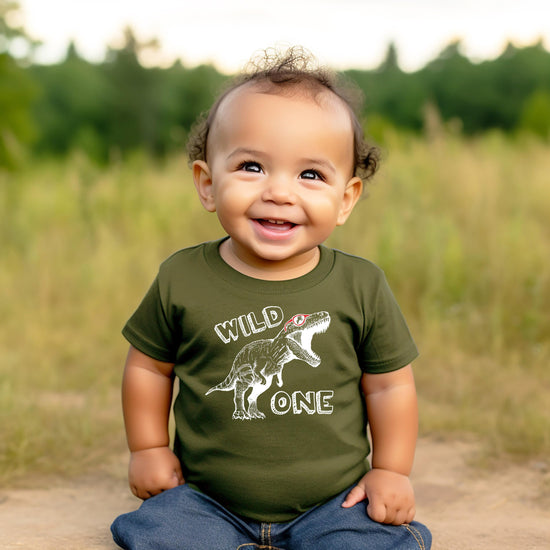 Wild One Dinosaur birthday shirt modeled on baby showing comfortable fit and sizing