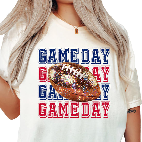 Women's fall football fan pullover with bold faux glitter football design in blue and red