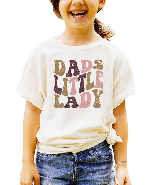 Girls natural tee with retro distressed Dad's Little Lady bubble font graphic in warm vintage colors