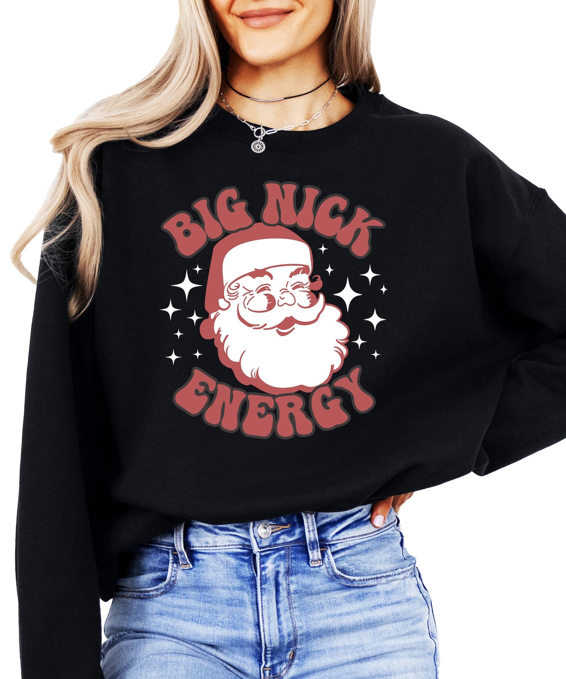 Women's black pullover sweatshirt with retro Big Nick Energy Santa graphic by Olive Loves Apple