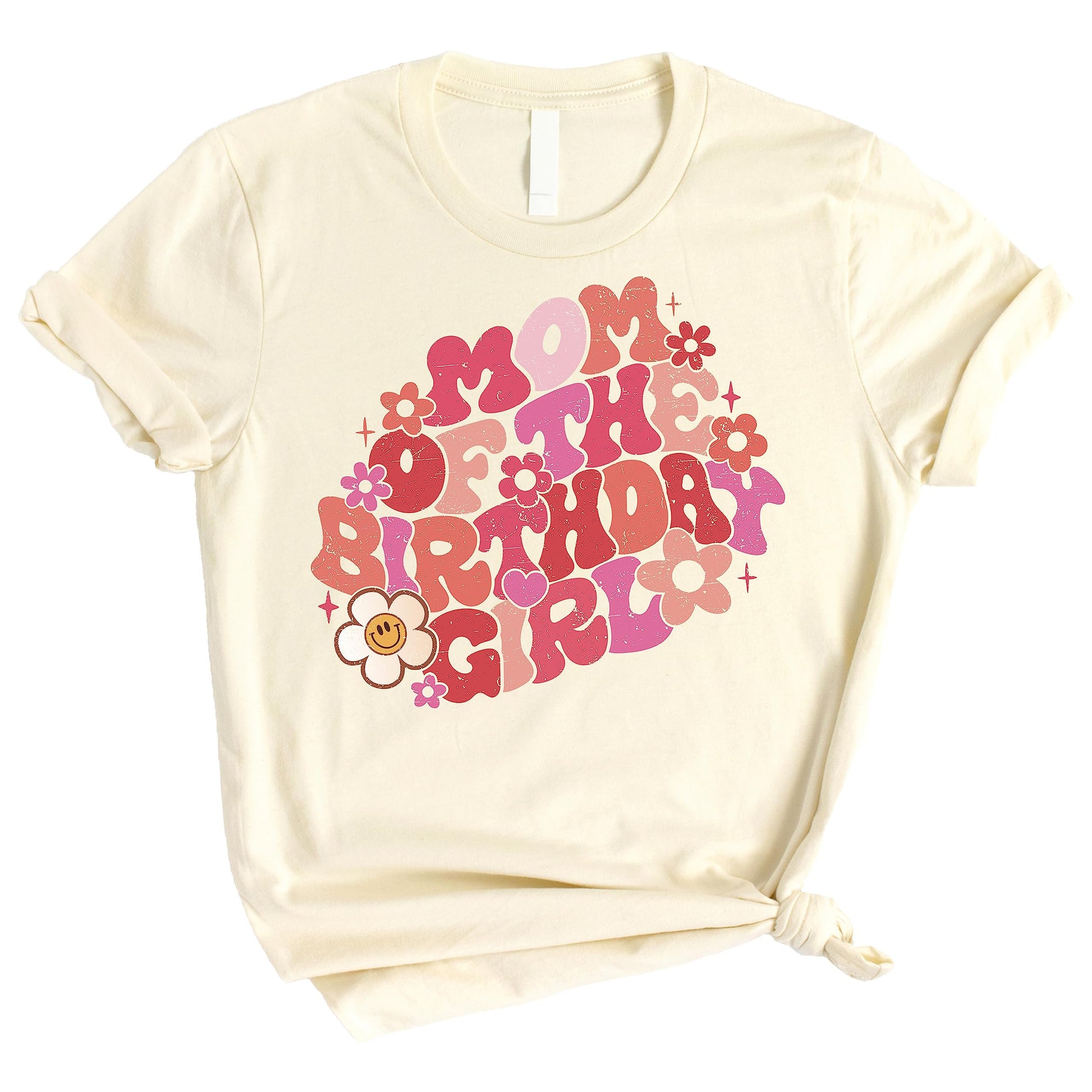 Mommy and me matching groovy daisy birthday shirts laid flat showing natural color and retro design