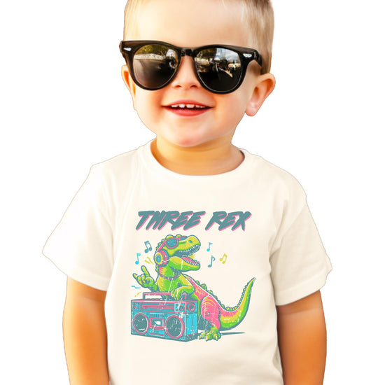 Toddler boys Three Rex DJ dinosaur birthday shirt with headphones and boombox graphic