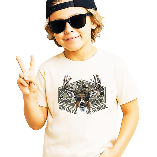 Front view of kids camo buck 100th day of school graphic tee in natural color