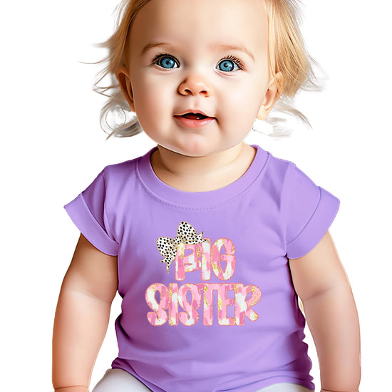 Detail shot of Big Sister leopard bow design on black youth graphic shirt