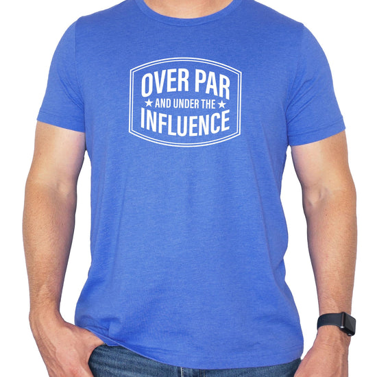 Flat lay of heather blue funny golf tee for men by Olive Loves Apple