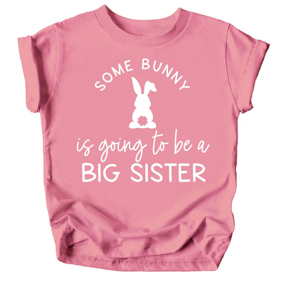 Front view of kids' peach Easter big sister announcement shirt with bunny graphic