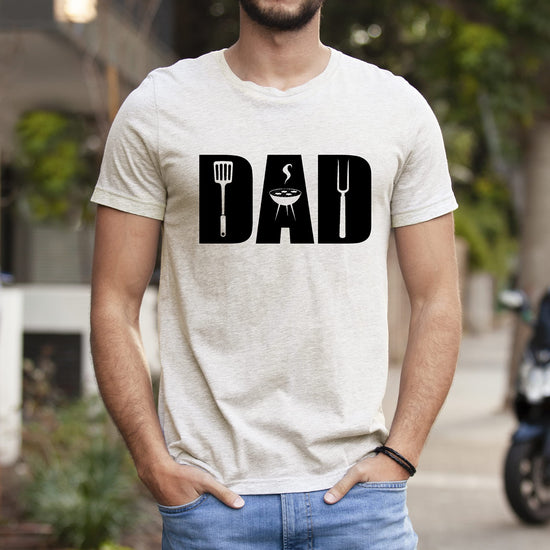 Detail shot of BBQ grill graphic on soft heather natural men's t-shirt