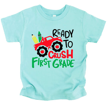 Kids graphic tee with bold truck design and Crush 1st Grade text, perfect for first day of school