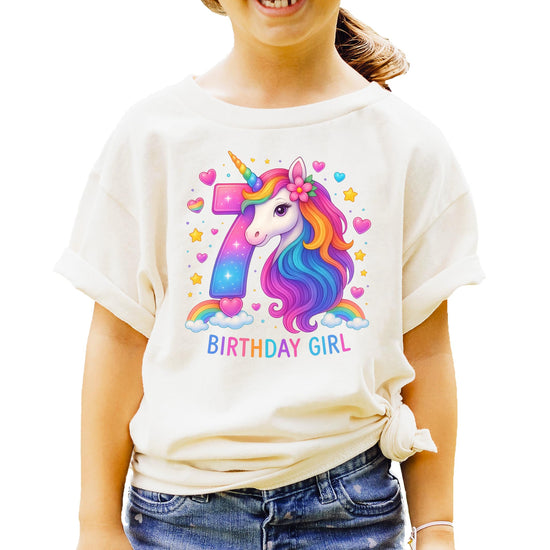 Full front view of girls pink unicorn birthday graphic tee with rainbow number seven