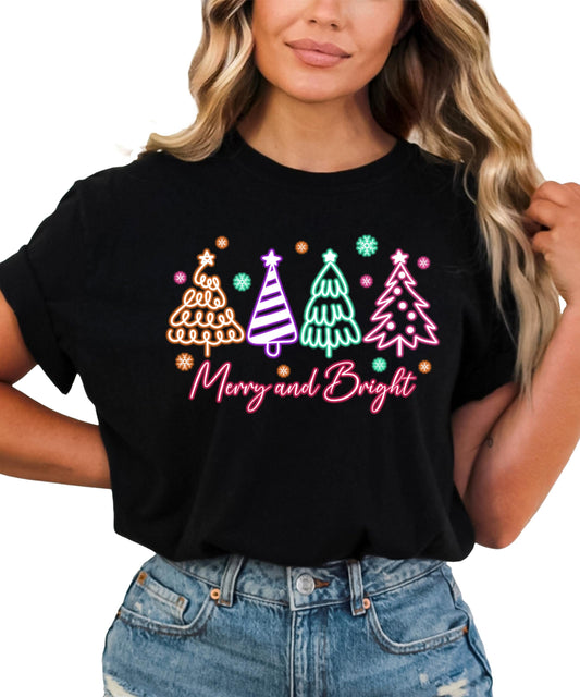 Front view of neon holiday Christmas shirt with glowing tree graphic on black tee