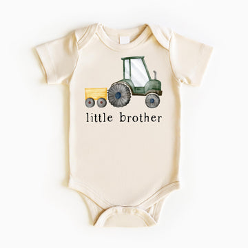 Little brother farm tractor bodysuit and shirt set displayed together for baby announcement