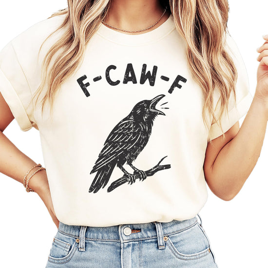 Front view of F-Caw-F funny crow Halloween shirt in seafoam green on adult model