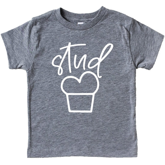 Close-up of Stud Muffin text design on blue boys shirt