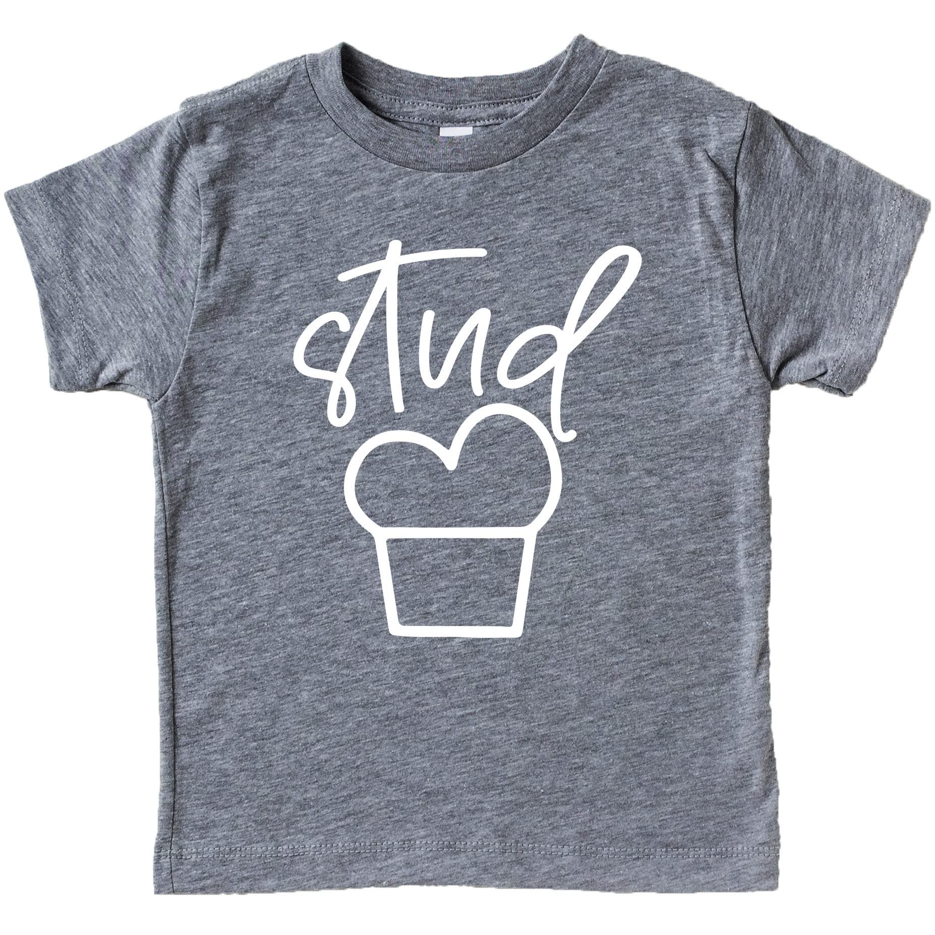 Close-up of Stud Muffin text design on blue boys shirt