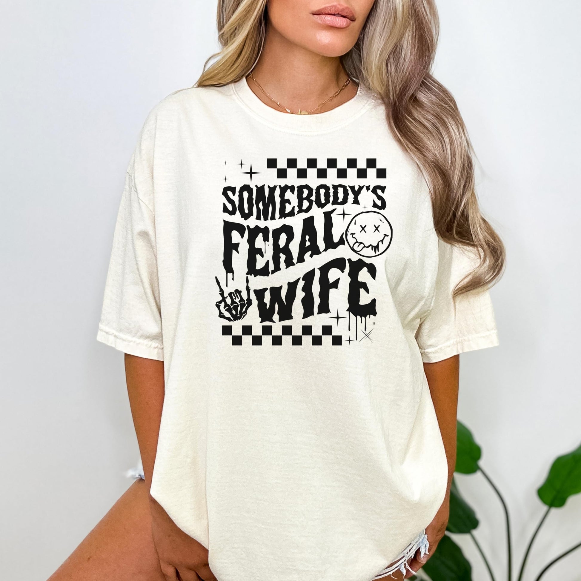 Women's Somebody's Feral Wife funny statement t-shirt, styled flat lay
