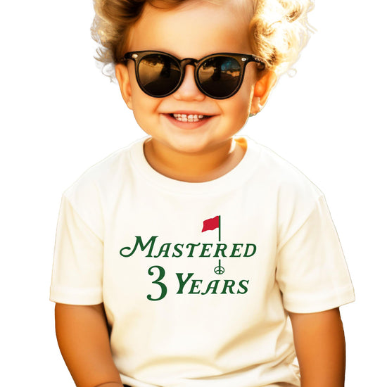 Natural toddler tee with golf-themed Mastered 3 Years third birthday graphic print