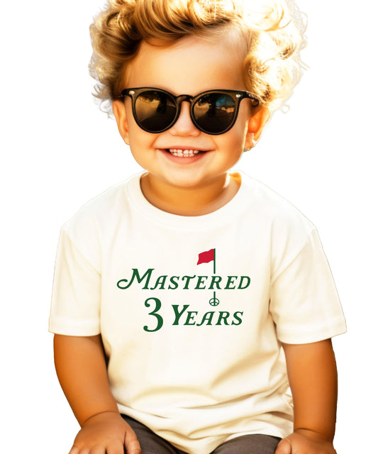 Natural toddler tee with golf-themed Mastered 3 Years third birthday graphic print
