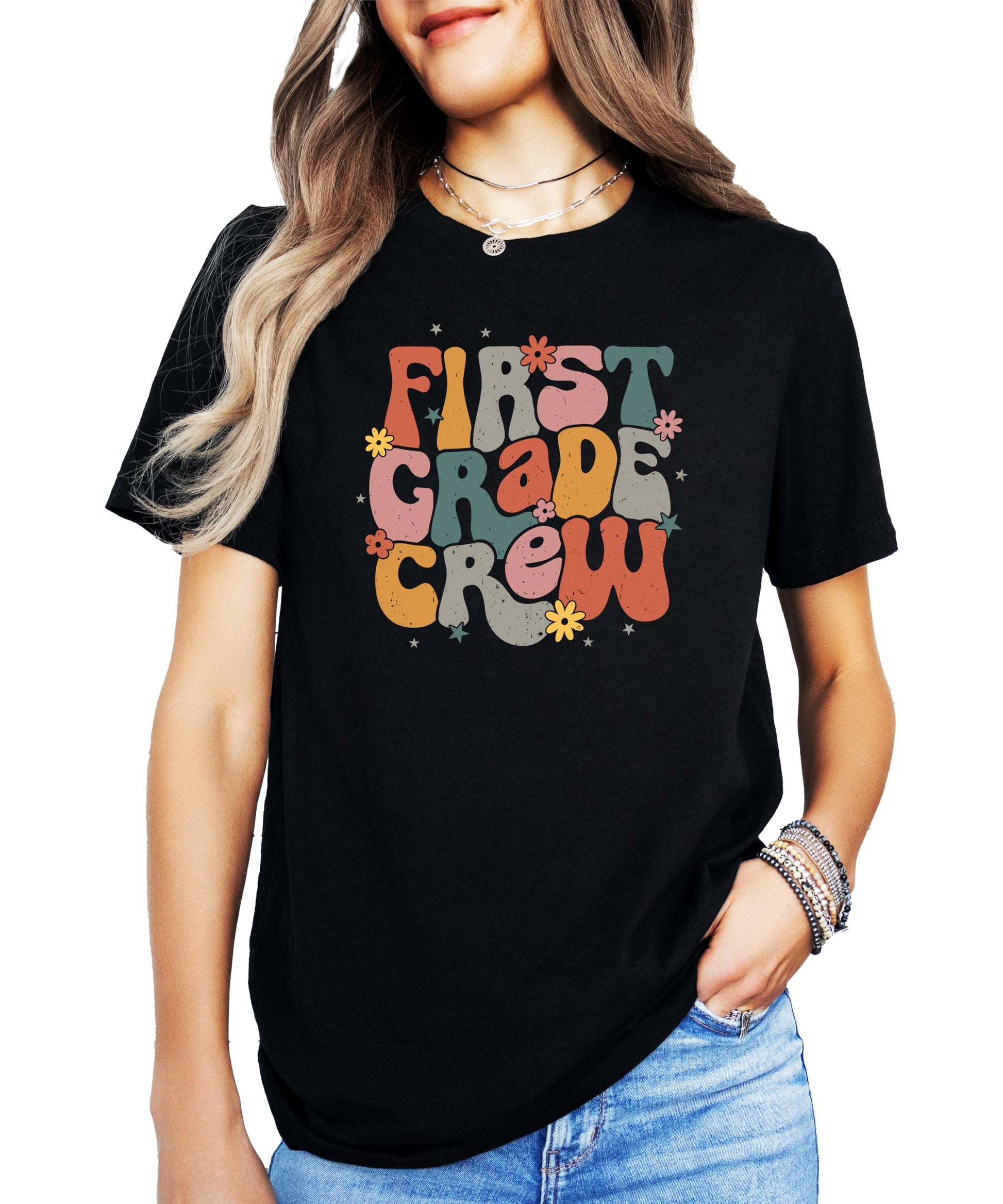 Close-up of bold retro First Grade Crew print on black kids' t-shirt