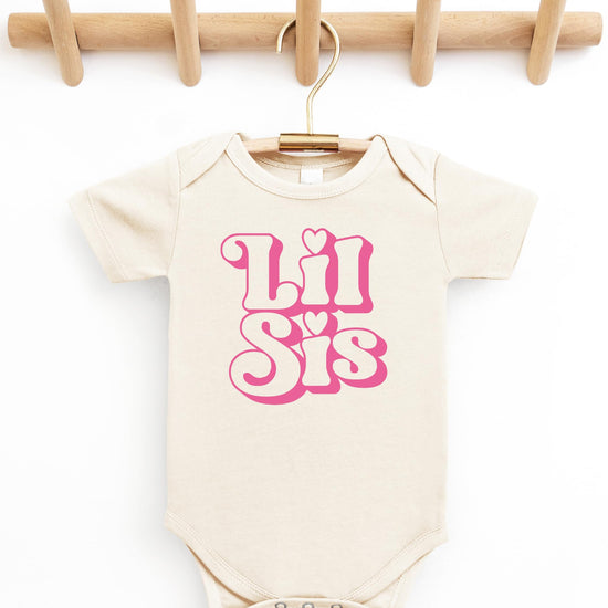Lil Sis newborn bodysuit displayed as a baby shower gift option for little sister announcement