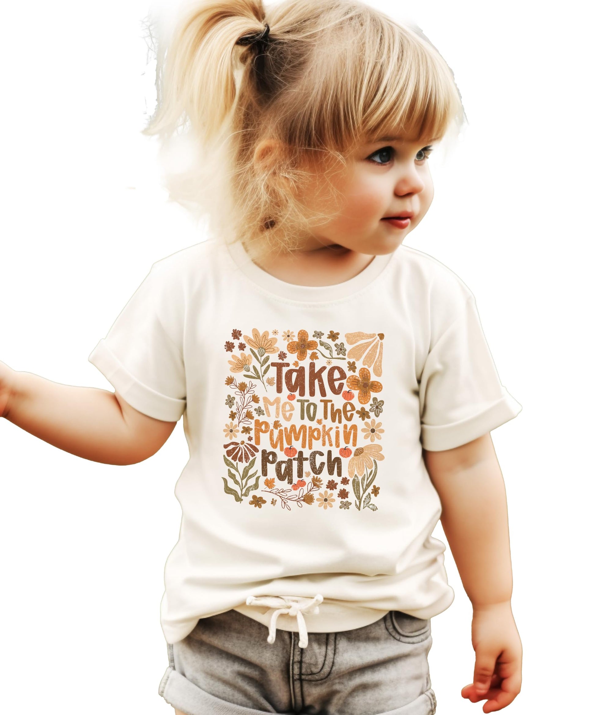 Close-up of pumpkin patch graphic tee showing colorful autumn floral pumpkin print details