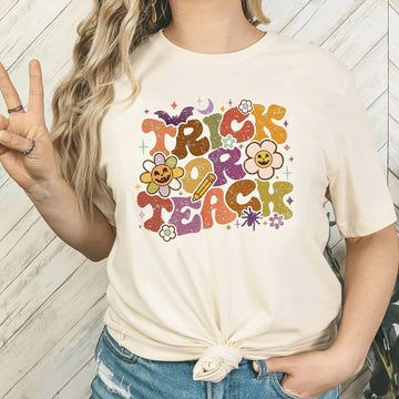 Trick or Teach Halloween teacher shirt flat lay showing full design detail