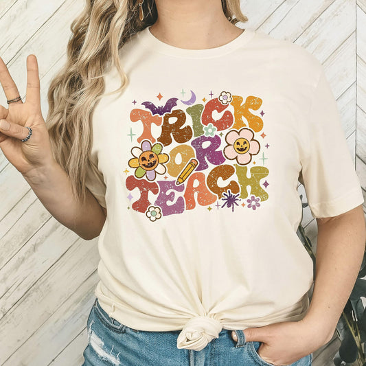 Trick or Teach Halloween teacher shirt flat lay showing full design detail