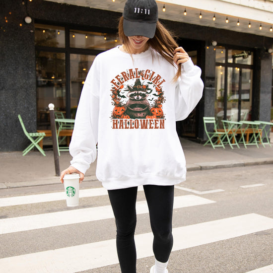 Flat lay or alternate view of the Feral Girl raccoon graphic women's fall sweatshirt