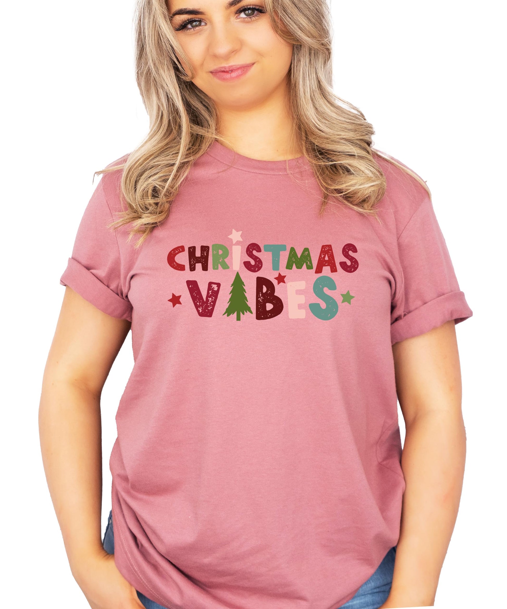 Adult and kids Christmas Vibes matching tee laid flat showing holiday graphic design