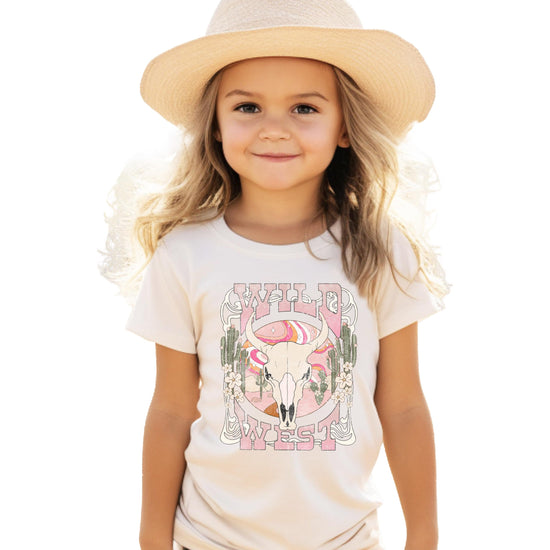 Front view of Wild West Western graphic tee for girls featuring colorful desert and cowgirl steer skull print