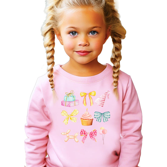 Toddler in pink pastel birthday sweatshirt with girly coquette party print
