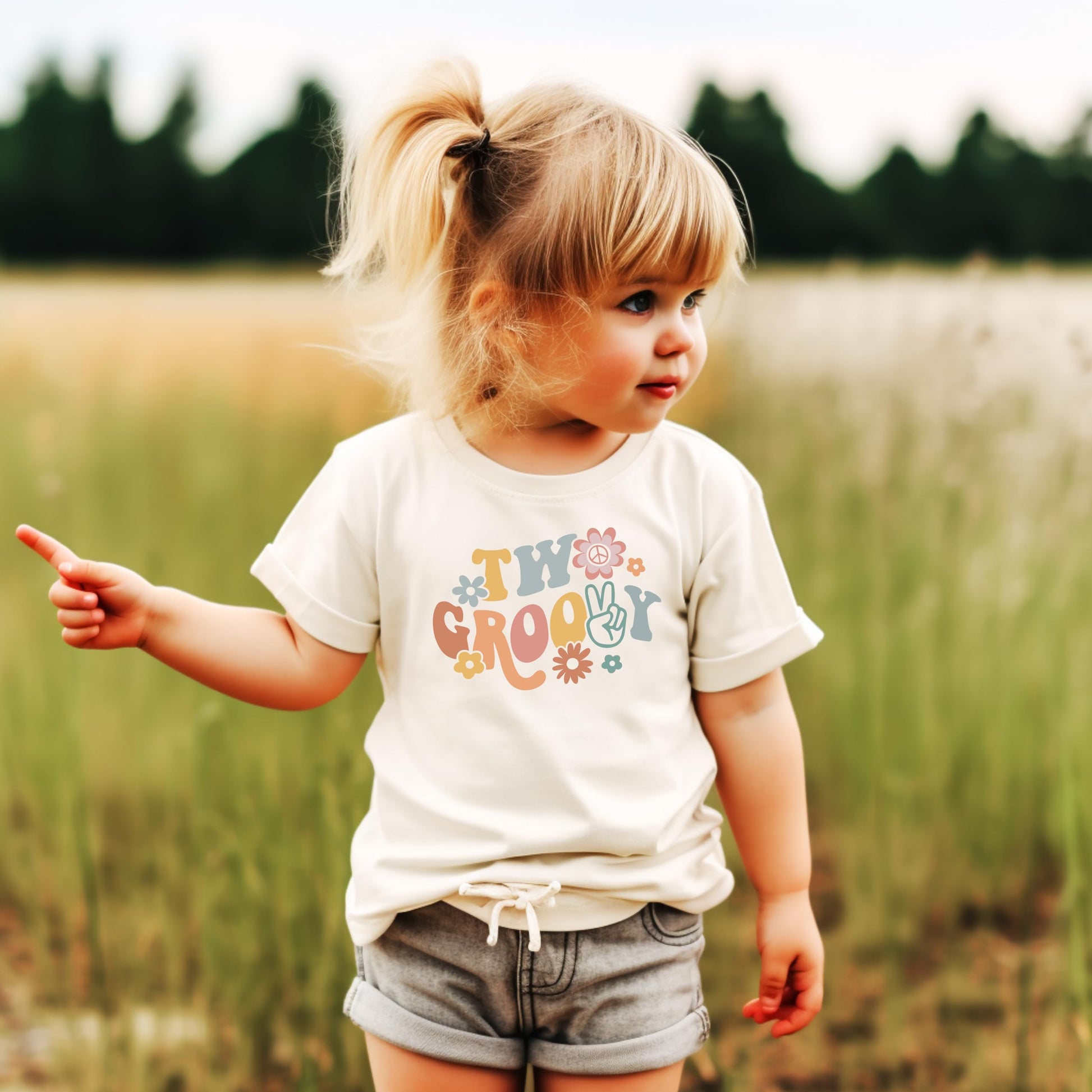 Toddler girl wearing Two Groovy daisy 2nd birthday shirt natural color full outfit