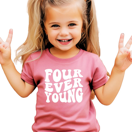 Flat lay of groovy retro Four Ever Young kids' birthday t-shirt