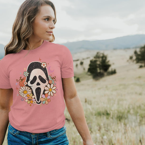 Women modeling groovy Scream face mask graphic Halloween t-shirt