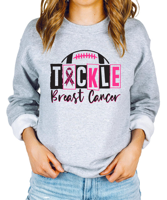Close-up of pink ribbon football design on gray sweatshirt showing print quality detail