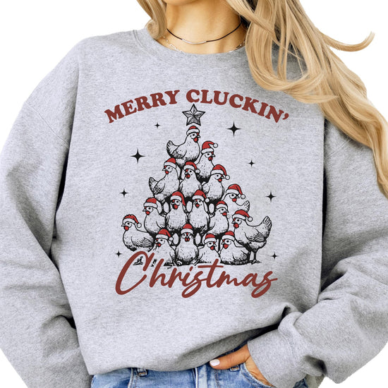 Front view of Merry Cluckin' Christmas sweatshirt showing chickens in Santa hats arranged as a Christmas tree